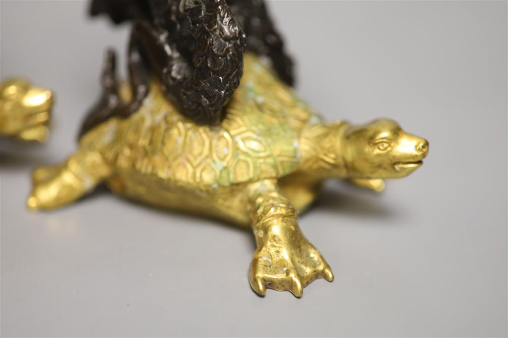 Two bronze and gilt metal candlesticks, modelled as Triton riding a tortoise, height 16.5cm